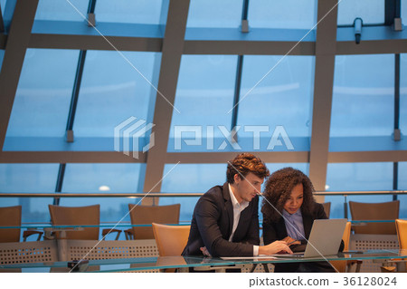 Business people having meeting around table in 36128024