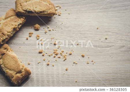 Apple strudel crispy pies on wood background. Apple strudel crispy pies on wood background. 36128305
