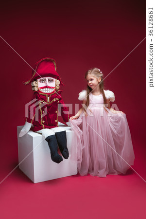 The beauty ballerina standing with nutcracker The beauty ballerina standing with nutcracker 36128661