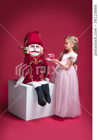 The beauty ballerina standing with nutcracker The beauty ballerina standing with nutcracker 36128666