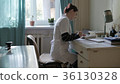 medical doctor in the office at the table. doctor 36130328
