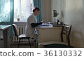 doctor in the office at the table. doctor in a 36130332