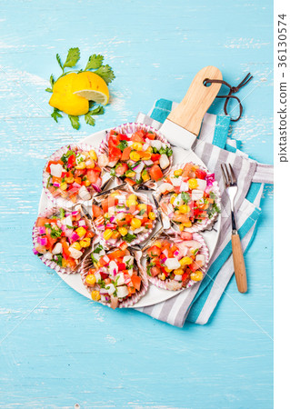 Peruvian style food Scallops a la chalaca 36130574