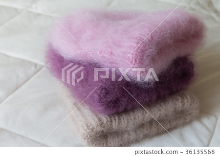Fluffy hats of various styles and colors hand 36135568