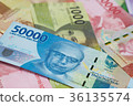 50,000 Rupiah bills and Indonesian money 36135574