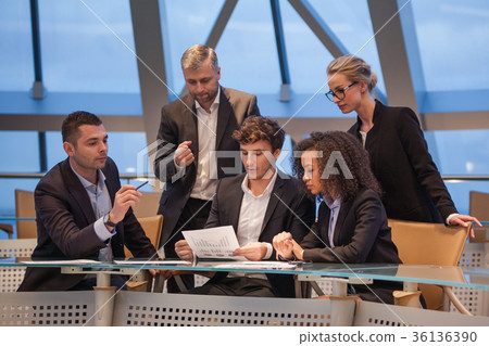Group of business people having meeting together Group of business people having meeting together 36136390