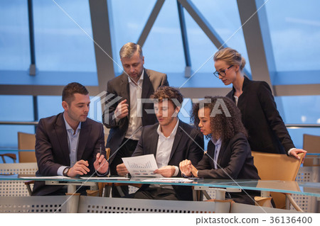 Group of business people having meeting together 36136400