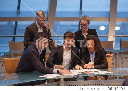 Group of business people having meeting together Group of business people having meeting together 36136404