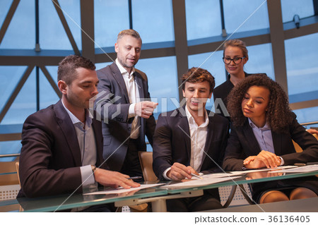 Group of business people having meeting together Group of business people having meeting together 36136405