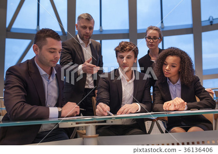 Group of business people having meeting together Group of business people having meeting together 36136406