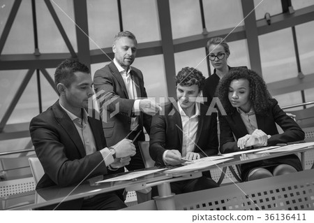 Group of business people having meeting together Group of business people having meeting together 36136411