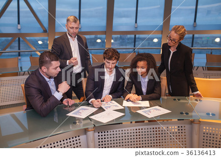 Group of business people having meeting together Group of business people having meeting together 36136413