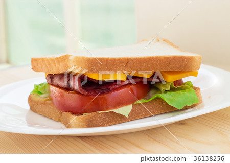 Grilled bacon and tomato club sandwich with cheese 36138256