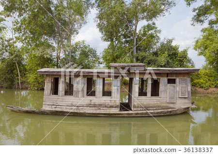 Old abandoned wooden boat in canal Old abandoned wooden boat in canal 36138337
