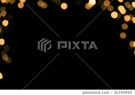 Abstract gold sparkle on dark background Abstract gold sparkle on dark background 36140948