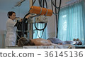doctor in the office at the table. doctor in a 36145136