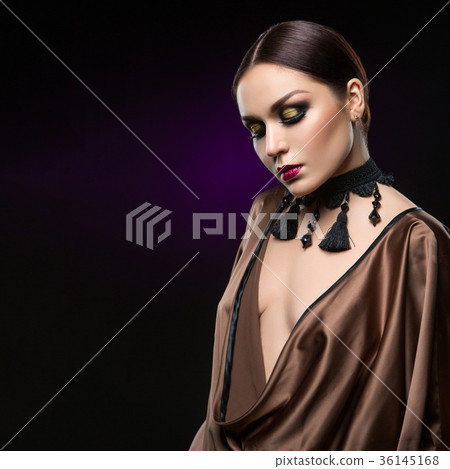 beautiful young woman with dark makeup 36145168
