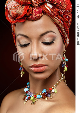 beautiful mulatto young woman with turban on head 36145215