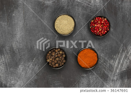 Various pepper on a black background. Top view Various pepper on a black background. Top view 36147691