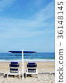 A pair of blue beach chairs in algarve 36148145