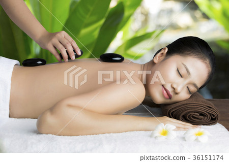 Asian woman relaxing with a spa treatment Asian woman relaxing with a spa treatment 36151174
