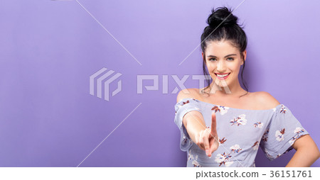 Young woman pointing at something 36151761