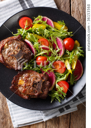 Roasted hot lamb steak and fresh vegetable salad 36153568