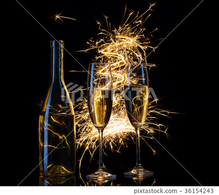 Festive champagne in the sparks of lights Festive champagne in the sparks of lights 36154243