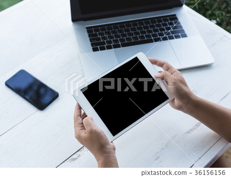 hand holding digital tablet showing screen hand holding digital tablet showing screen 36156156