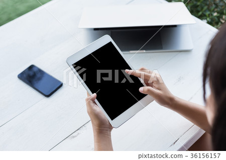 hand holding digital tablet finger point on screen hand holding digital tablet finger point on screen 36156157