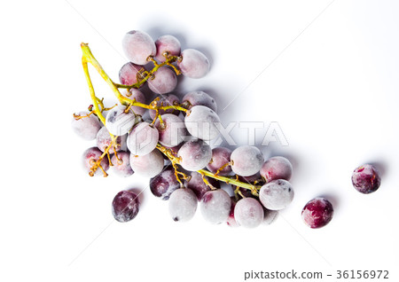 Frozen grapes cluster on white background Frozen grapes cluster on white background 36156972