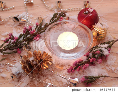 Powdered snow and Christmas ornaments and aroma candles 36157611
