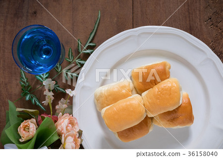 Tasty sausage rolls bread with flower Flat lay Tasty sausage rolls bread with flower Flat lay 36158040