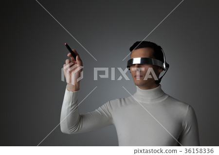 Man using futuristic VR goggles 36158336