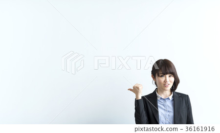 A female teacher who plays guts in front of the white board 36161916