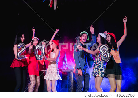 Teenagers are celebrating at the night party. 36162796