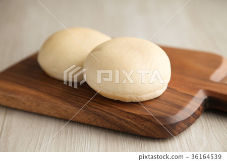 White bread on a wooden cutting board 36164539