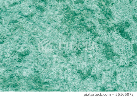 Emerald green painted stucco wall. 36166072