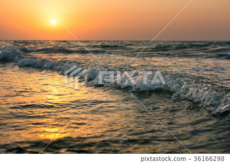 Calm sunset on the beach 36166298