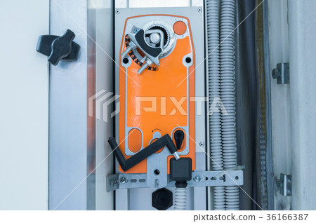 Orange industrial actuating motor nstalled on the Orange industrial actuating motor nstalled on the 36166387