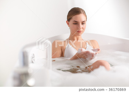 Sensual girl keeping water bubbles in arms Sensual girl keeping water bubbles in arms 36170869