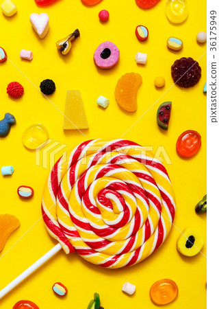 colorful candy on the yellow background colorful candy on the yellow background 36175949