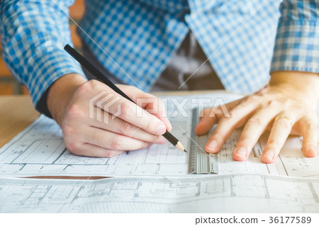 Architect or engineer working in office blueprint Architect or engineer working in office blueprint 36177589