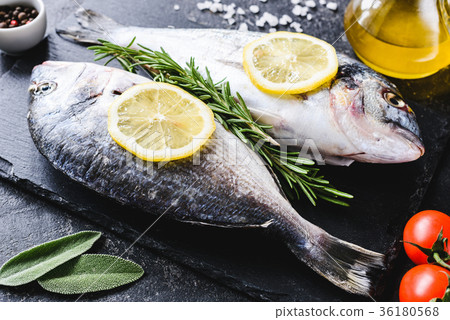 Fresh sea fish on slate board ready for cooking 36180568
