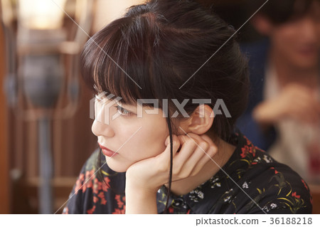 Young people spending time in a cafe 36188218