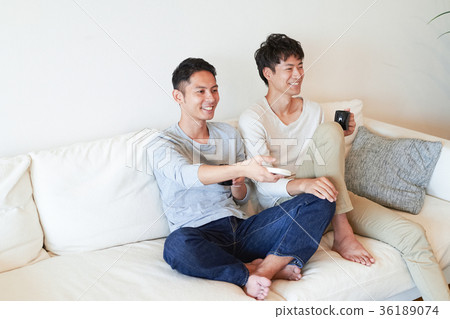 Men relaxing in the living room 36189074