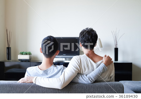 Men relaxing in the living room Men relaxing in the living room 36189430