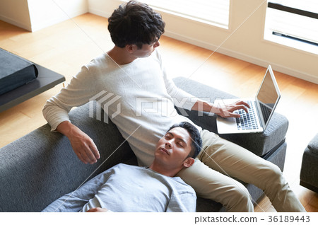 Men relaxing in the living room 36189443