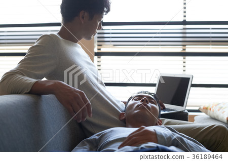 Men relaxing in the living room Men relaxing in the living room 36189464