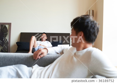 Men relaxing in bed 36189752